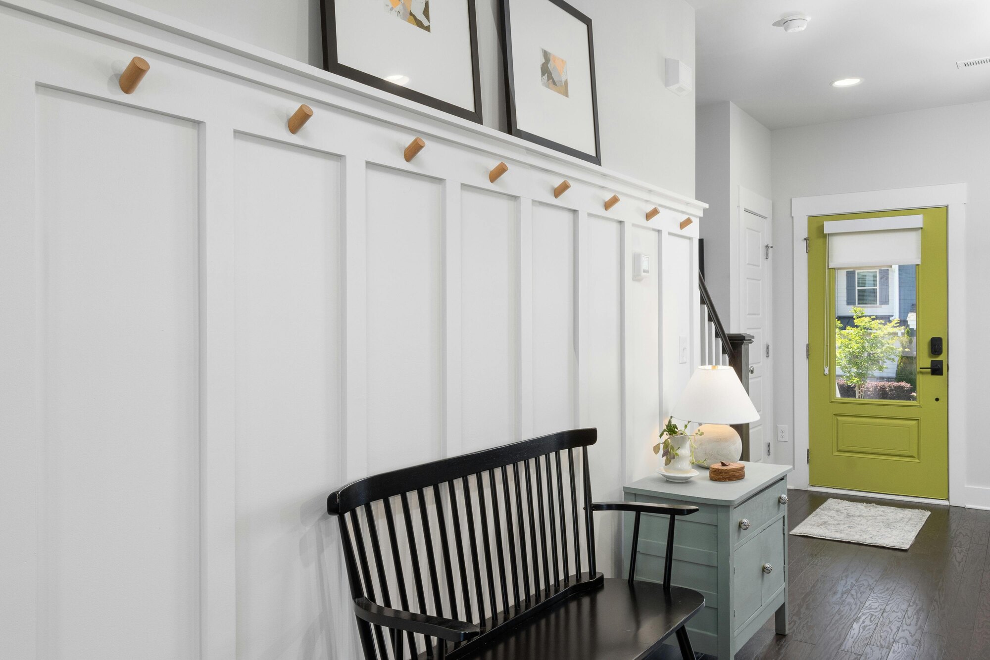 Stylish entryway with lime green door in a Kaizen Homes custom home in Montreat, NC