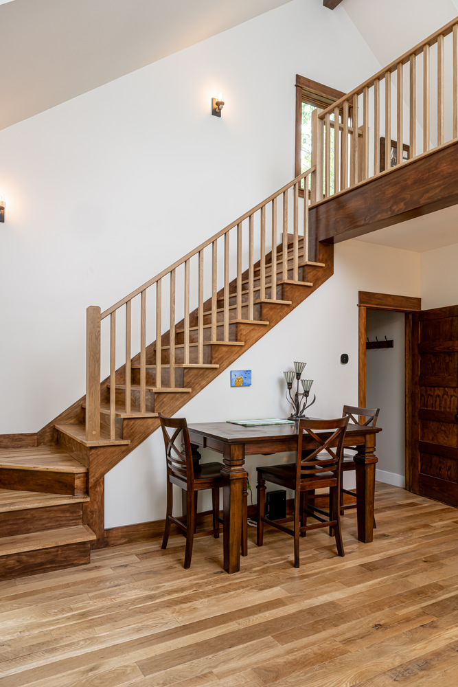 Custom-built staircase and dining nook in a Kaizen Homes project in Marshall, NC