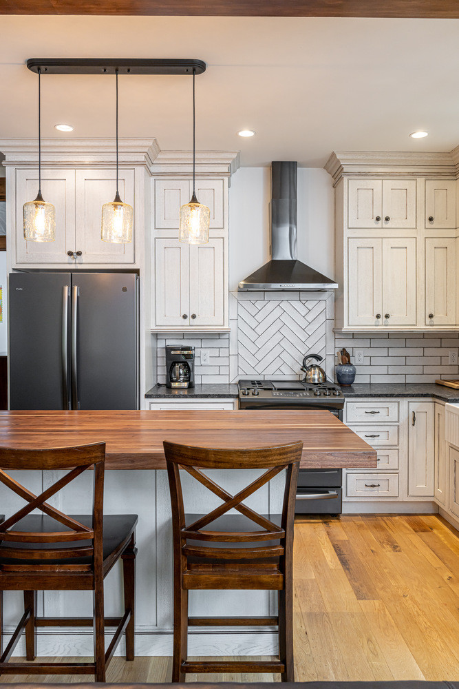 Elegant kitchen remodel with wood countertops and white cabinetry in Montreat, NC