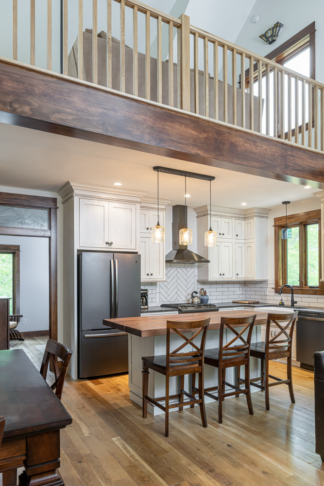 Lofted ceiling over custom kitchen and island in a Kaizen Homes build in Weavervill