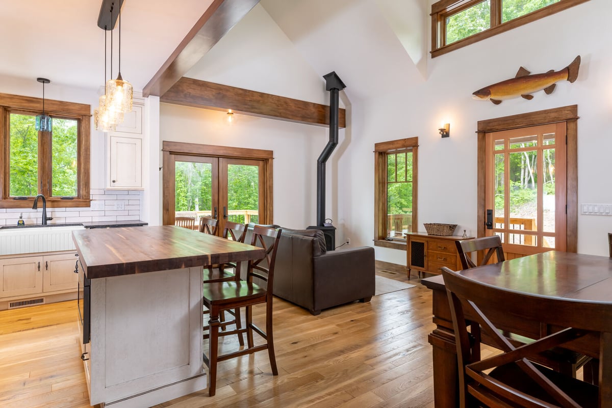 Open layout design featuring kitchen and living area in a custom Fairview, NC