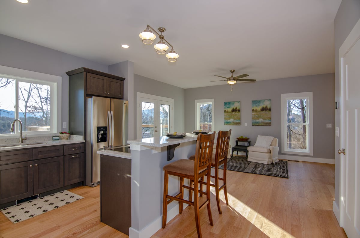 Spacious modern kitchen and living space designed by Kaizen Homes in Canton, NC