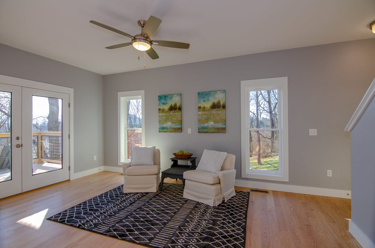 Stylish and bright living room with modern layout by Kaizen Homes in Canton, NC