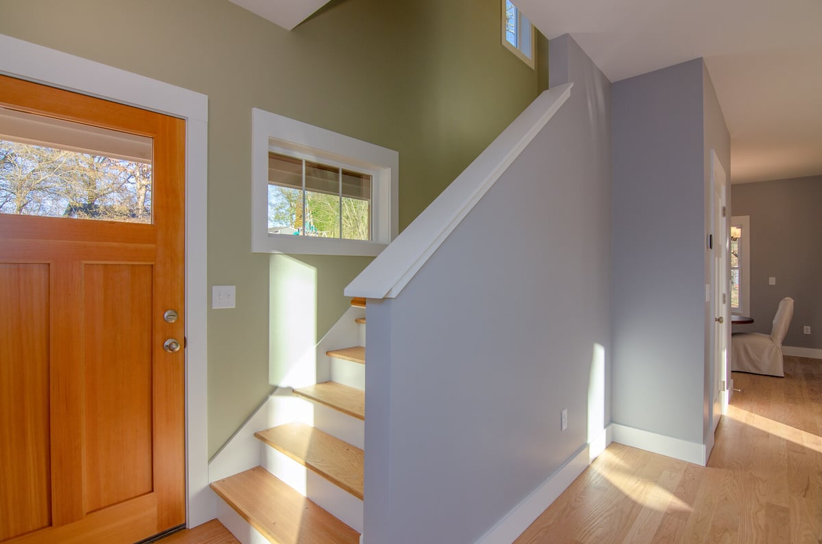 Transitional hallway and staircase area in custom Kaizen Homes build in Canton, NC