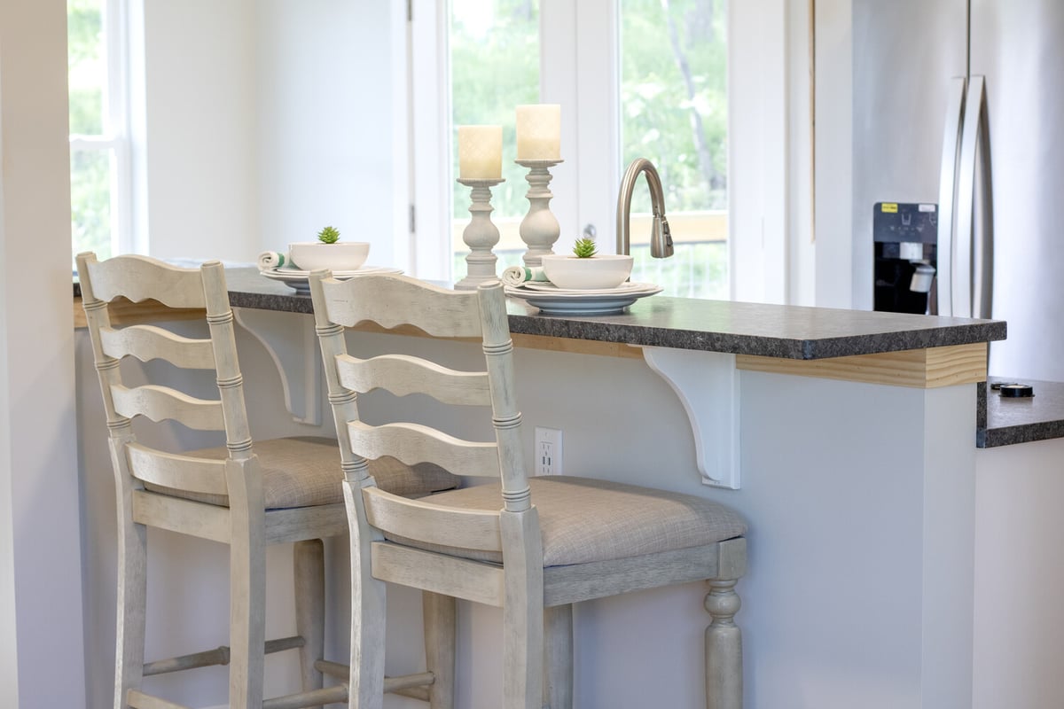 Custom kitchen island with bar seating in a Kaizen Homes home in Canton, NC