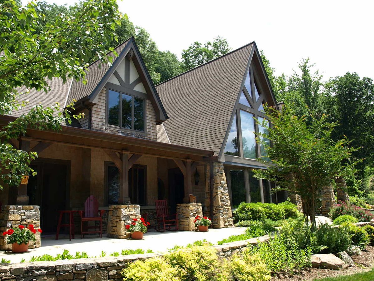 Custom mountain home with stone landscaping by Kaizen Homes in Swannanoa, NC
