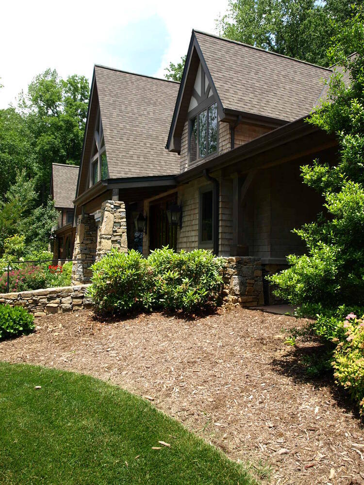 Side view of Tudor-style custom home by Kaizen Homes in Asheville, NC