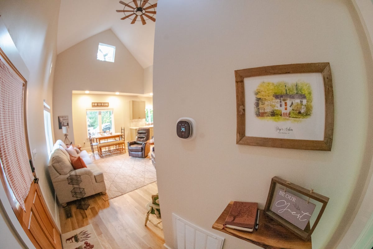 Entryway view into cozy open-concept living area in Kaizen Homes custom home