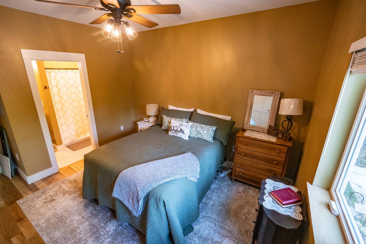 Interior bedroom remodel featuring rustic decor by Kaizen Homes in Black Mountain