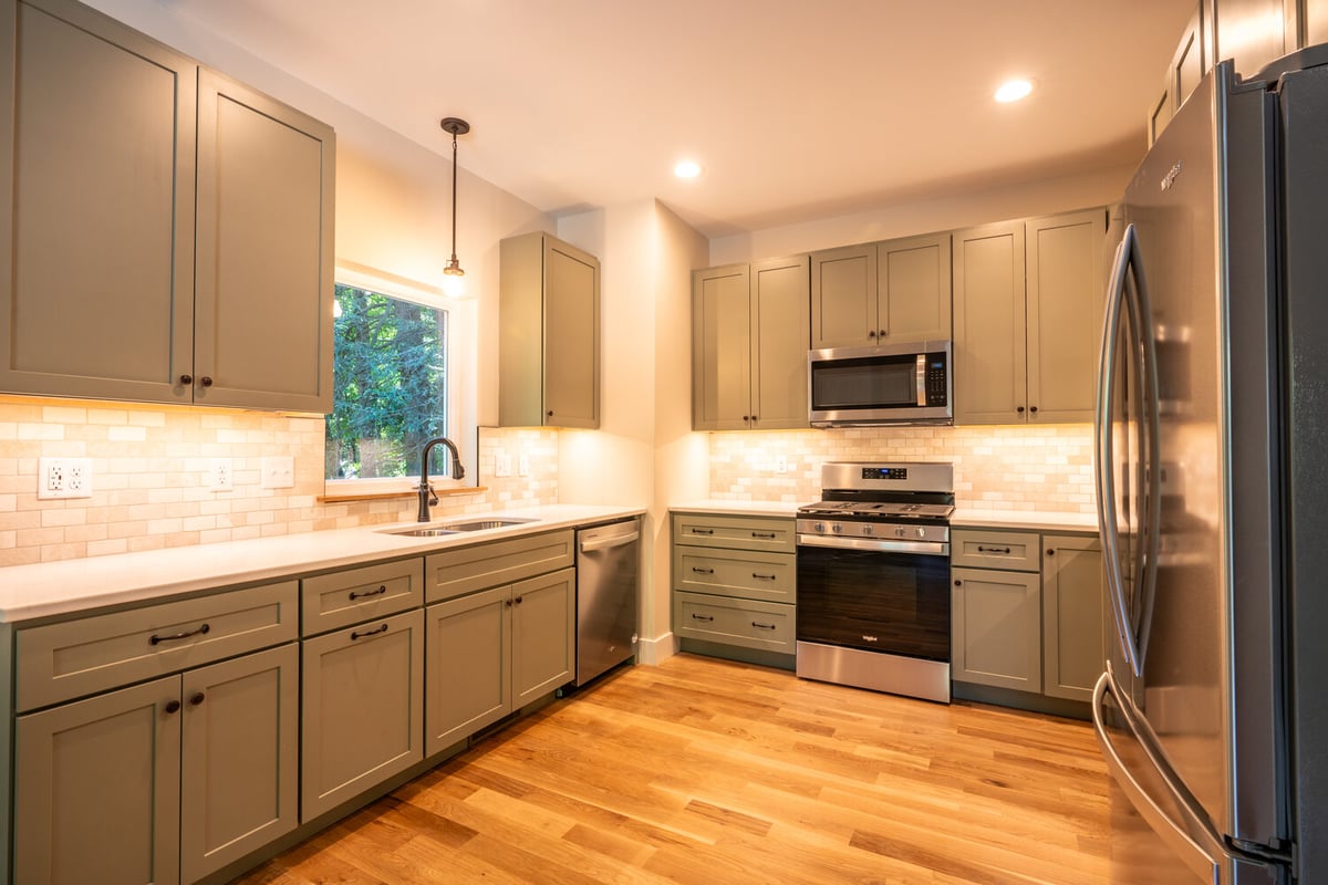 Modern cabinetry and sleek countertops in kitchen remodel by Kaizen Homes