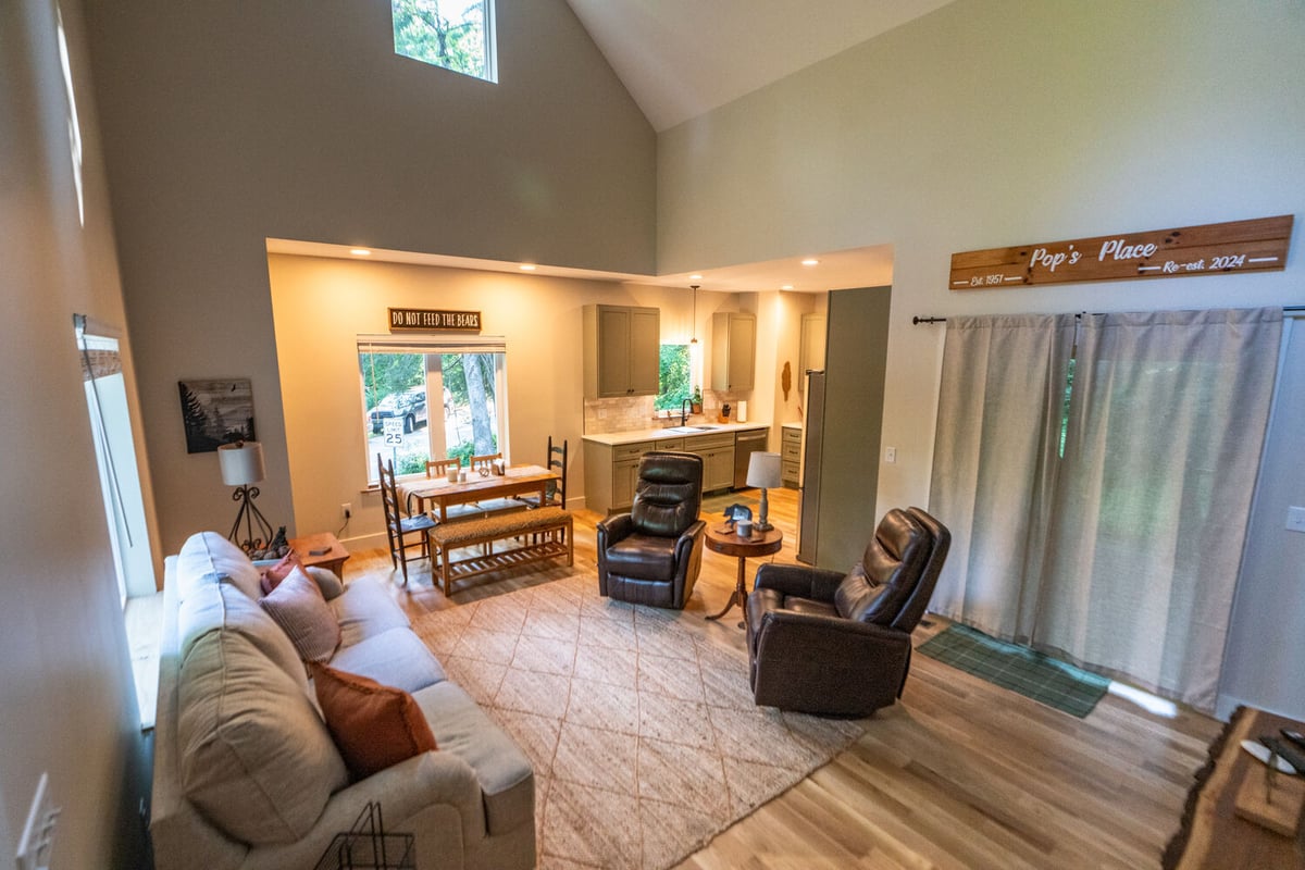 Open-concept living room and kitchen in a custom home by Kaizen Homes