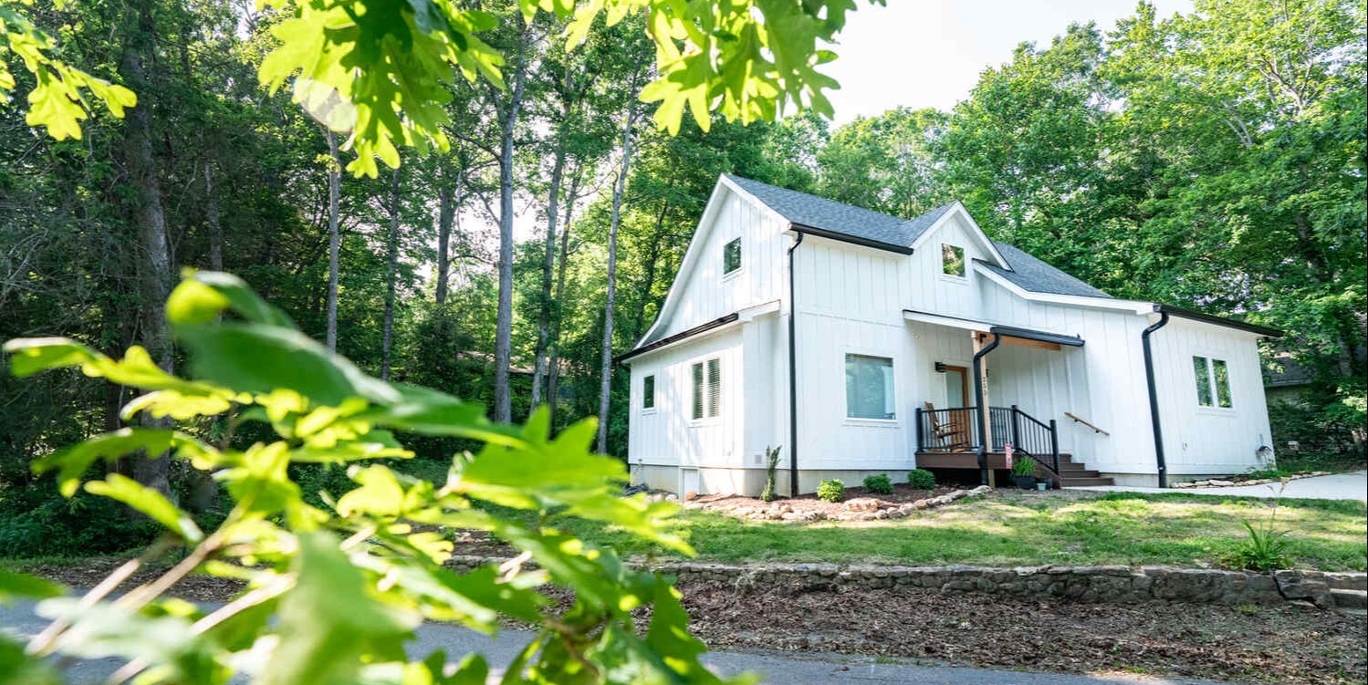 Scenic exterior of Kaizen Homes custom residence surrounded by trees