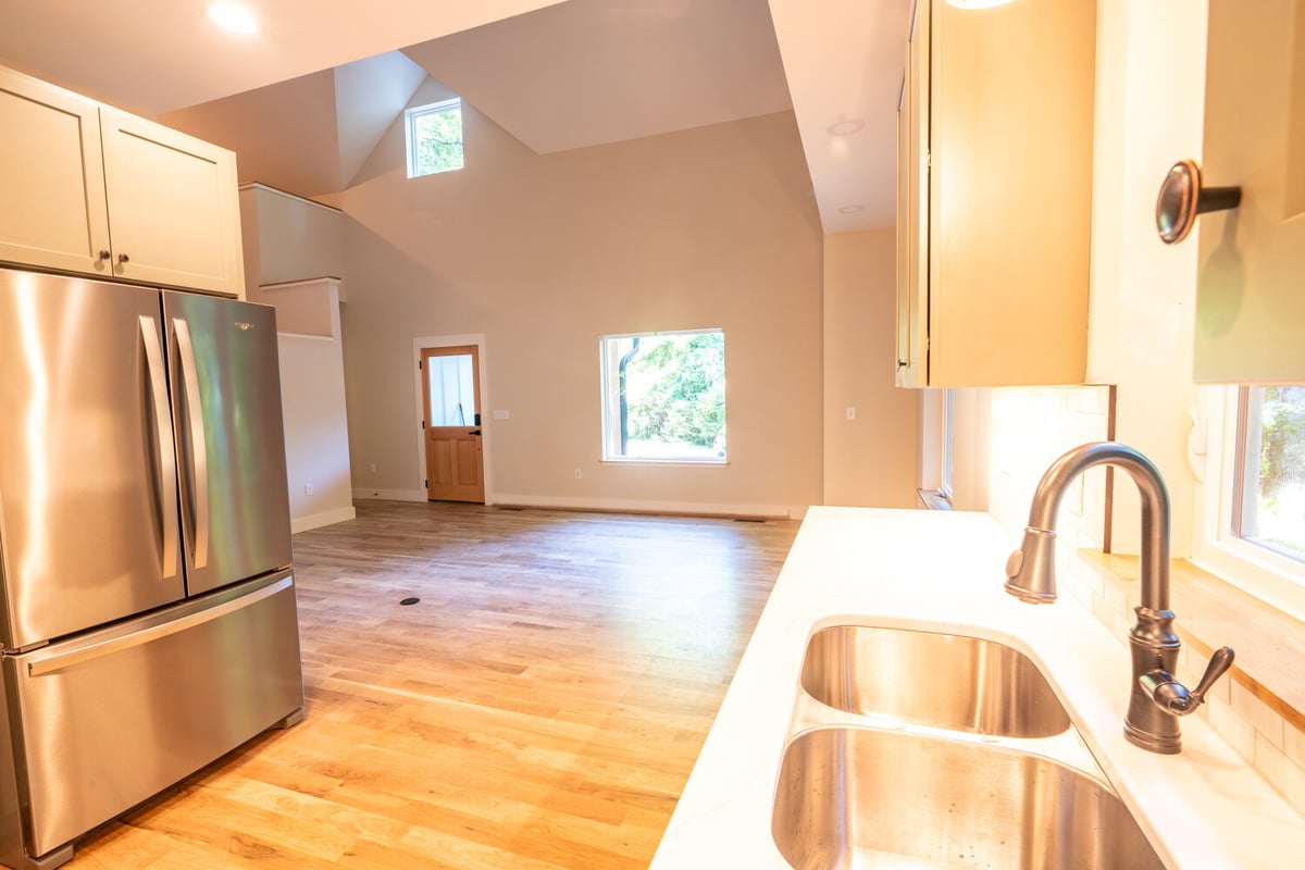 Stainless appliances and bright interior in a custom kitchen by Kaizen Homes