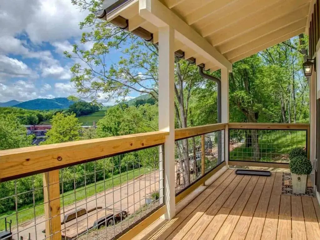 The front porch of this home as well as the beautiful view of the mountains.