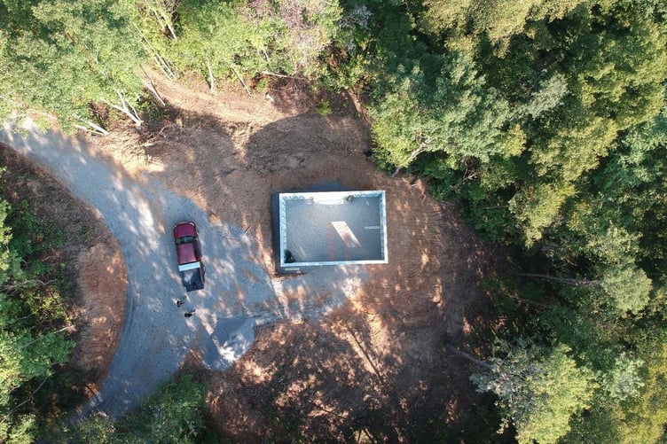 Overhead drone photo of Superior Walls precast foundation on custom mountain home site in Western North Carolina