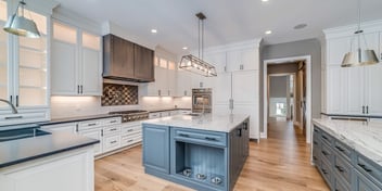 Open concept kitchen with blue island