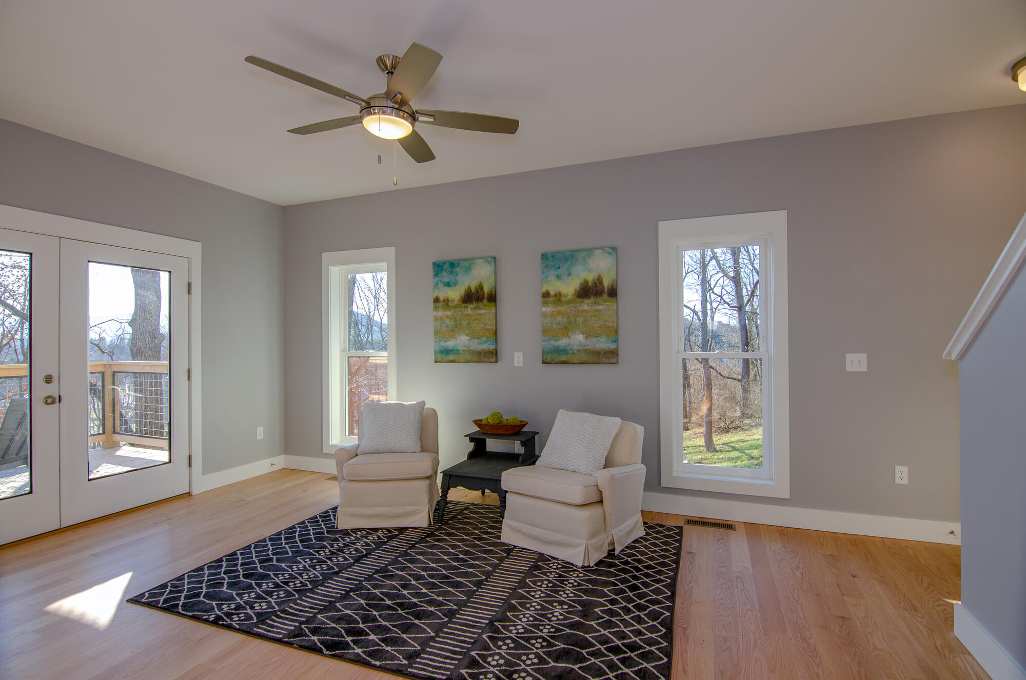 Stylish and bright living room with modern layout by Kaizen Homes in Canton, NC