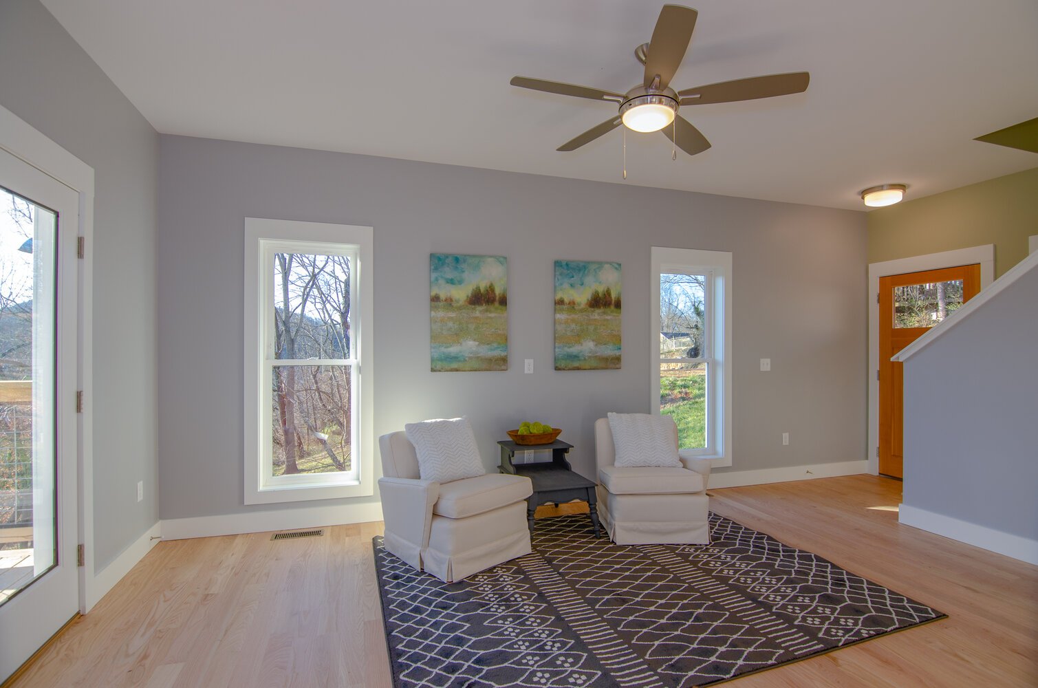 Bright and airy custom living room with simple décor by Kaizen Homes in Canton, NC
