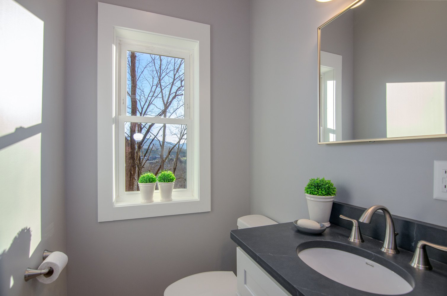 Bright and minimal bathroom space in a Kaizen Homes custom home in Canton, NC