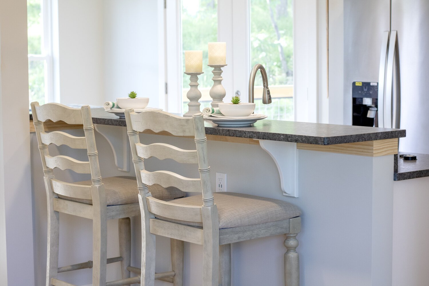 Custom kitchen island with bar seating in a Kaizen Homes home in Canton, NC