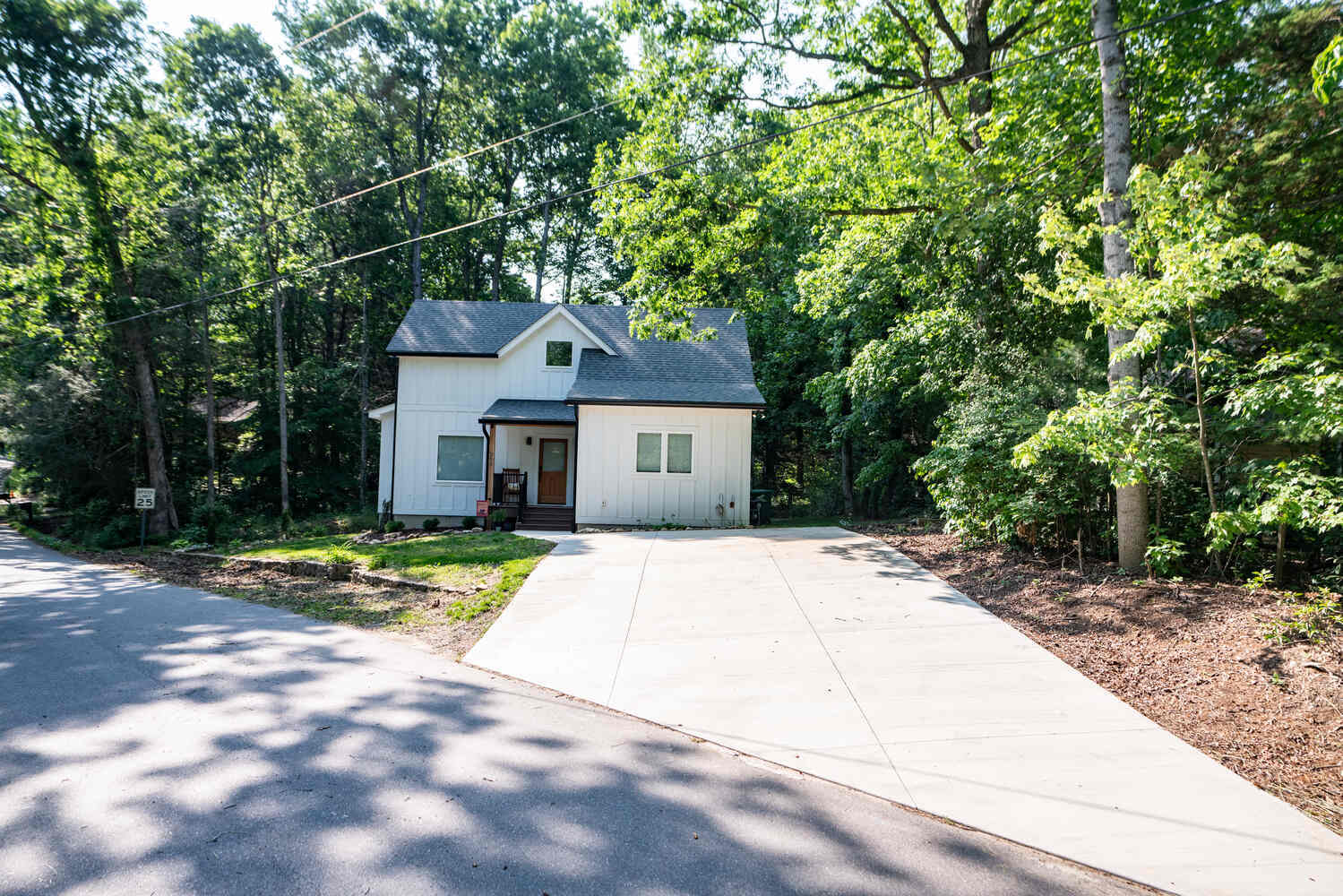 White board-and-batten custom home in Black Mountain, NC by Kaizen Homes