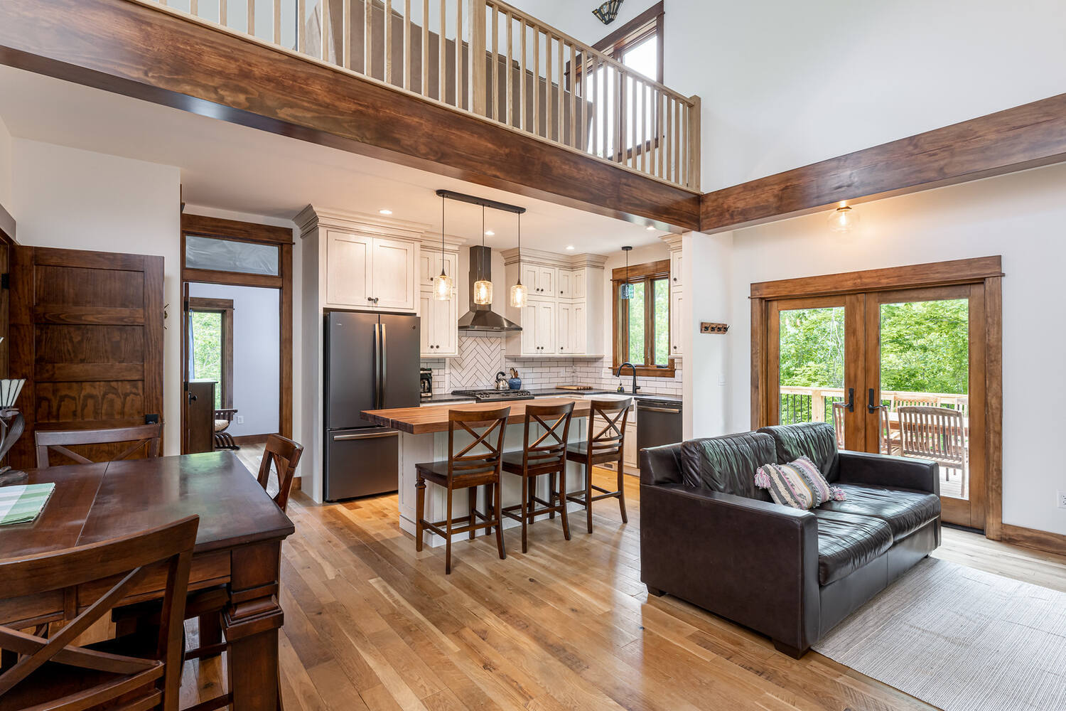 Custom-built kitchen with breakfast bar and loft design by Kaizen Homes in Woodfin, NC